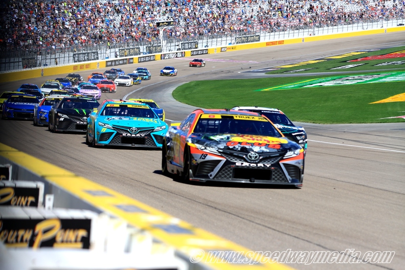 Martin Truex leads Denny Hamlin on restart