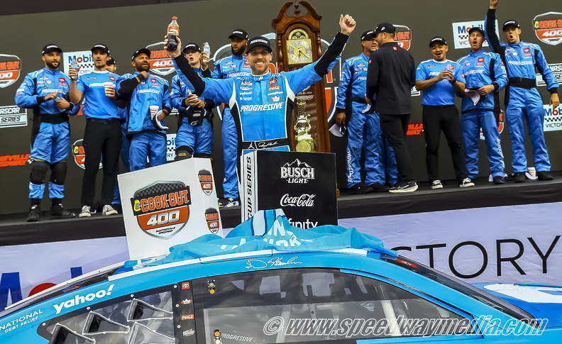 Denny Hamlin arms up.jpg
