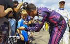 Alex Bowman signing a fan