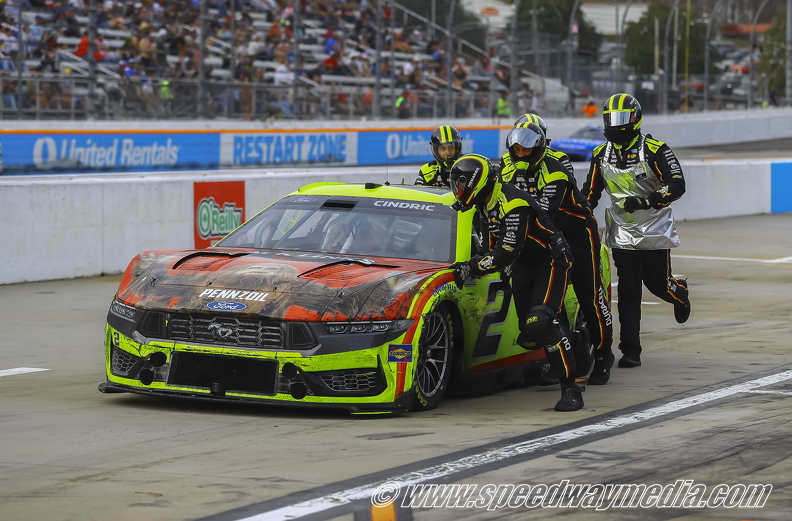 Austin Cindric being pushed down pit road.jpg