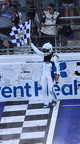 Kyle Larson with the chekered flag