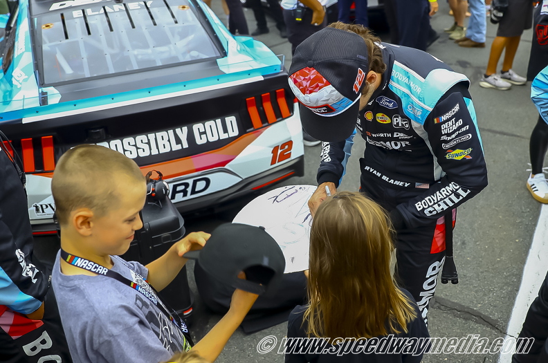 Ryan Blaney autographing for a fan.jpg