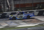 Tanner Gray under the flag stand