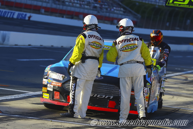 ARCA Officials hold a car.jpg