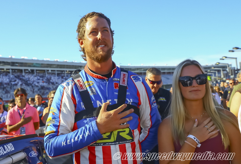 Cleetus McFarland  and wife during National Anthum.jpg