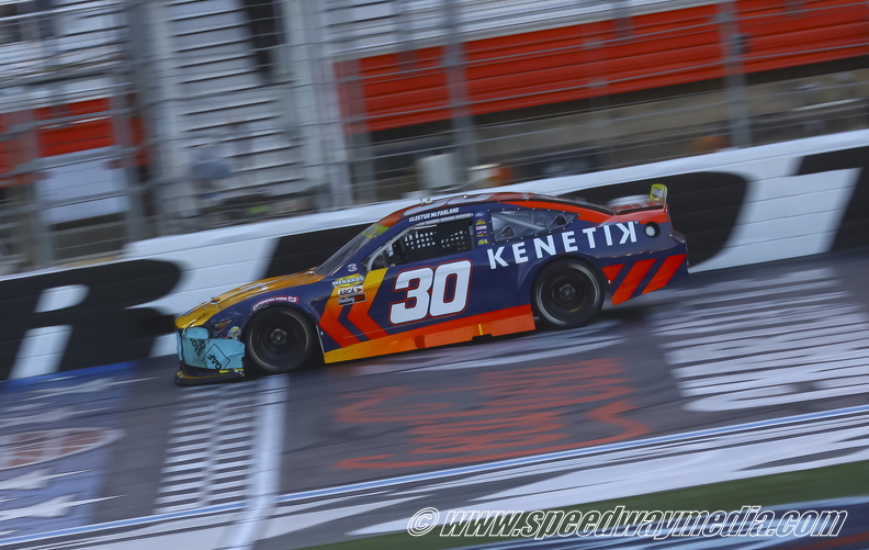 Garrett Mitchell under the flag stand.jpg