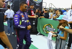 Bubba Wallace greeting a young fan