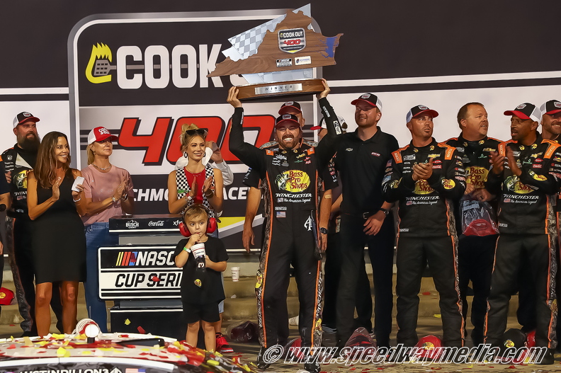 Austin dillon lifts the trophy.jpg