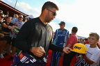 Bubba Wallace on the red carpet signing autogeraphs