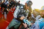Ross Chastain signing a fans collectable