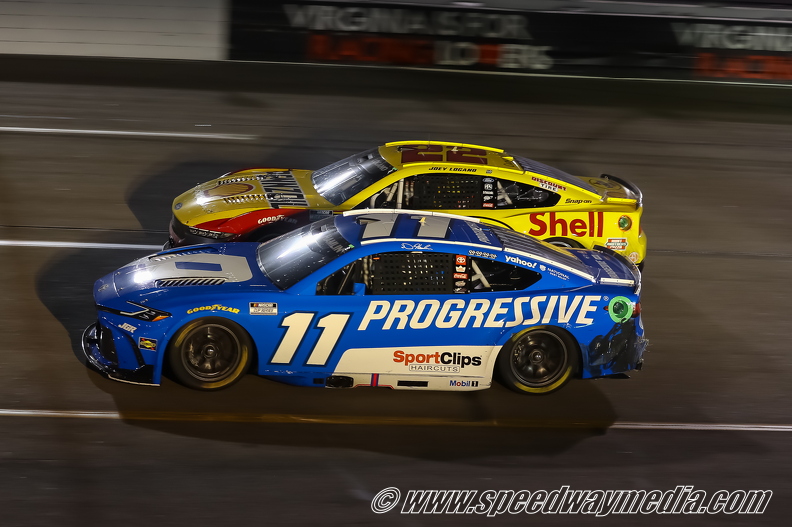 Denny Hamlin and Joey Logano battle for position.jpg