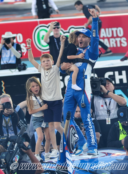 Kyle Larson celerbrates with children.JPG