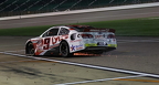 Landon S Hoffman heads down pit row on 3 wheels