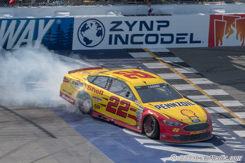 Joey Logano takes the checkered flag in the FireKeepers Casino 400