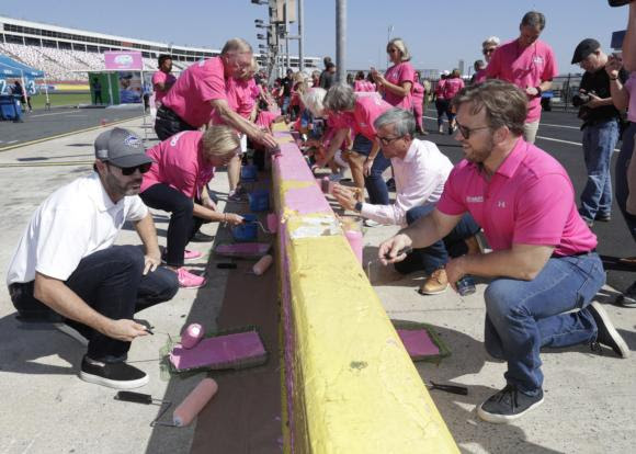 Jimmie Johnson, Breast Cancer Survivors and NASCAR XFINITY Series Drivers Paint Pit Wall Pink