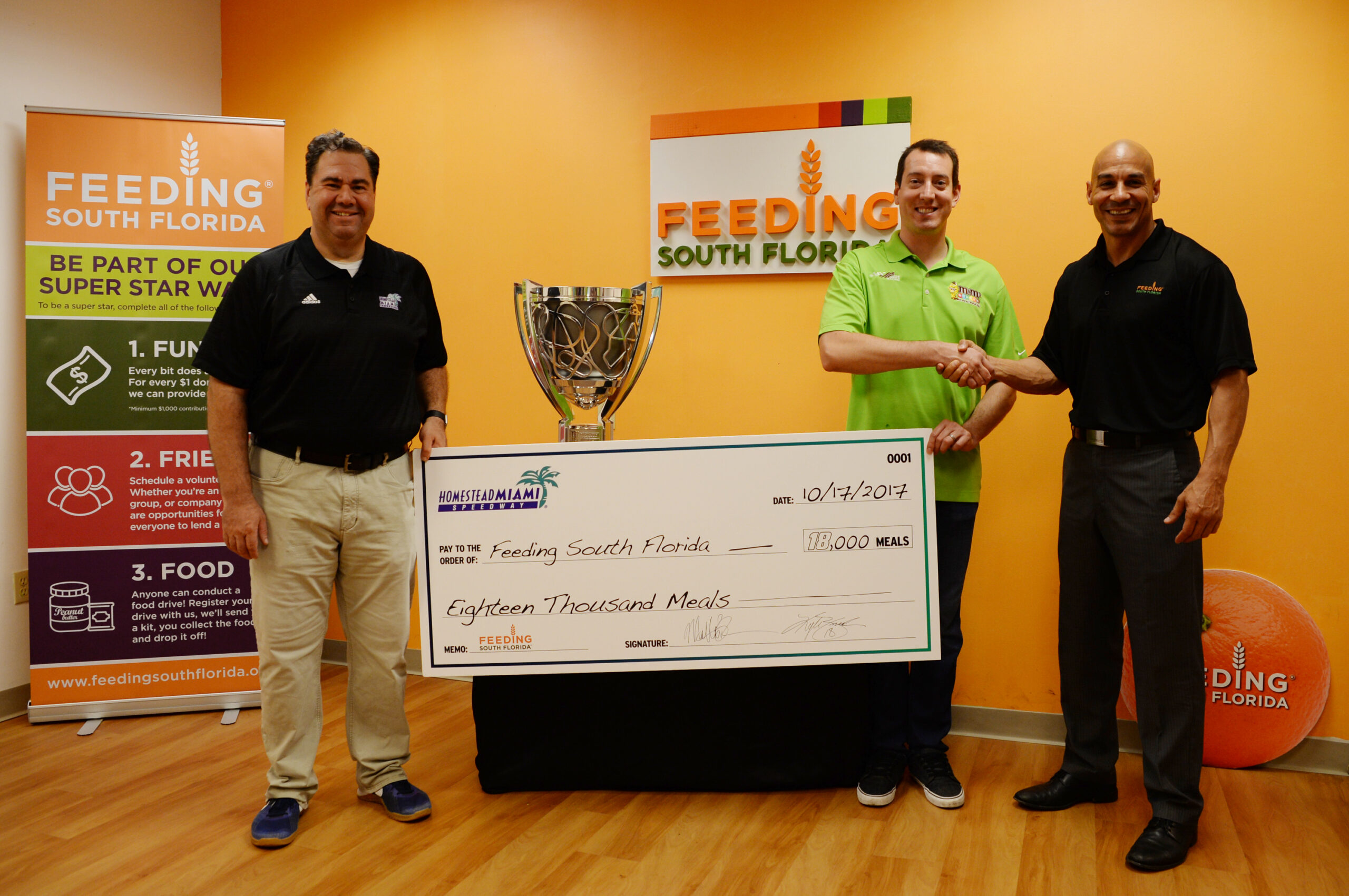 2015 MONSTER ENERGY SERIES CHAMPION KYLE BUSCH GIVES HELPING HAND AT FEEDING SOUTH FLORIDA