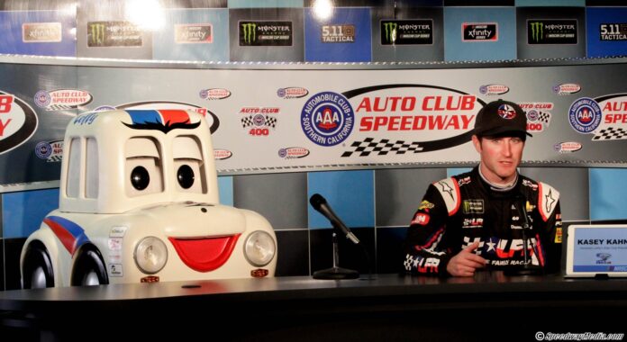 Kasey Kahne and "Lefty" address the media for a press conference. Photo by Rachel Myers for SpeedwayMedia.com