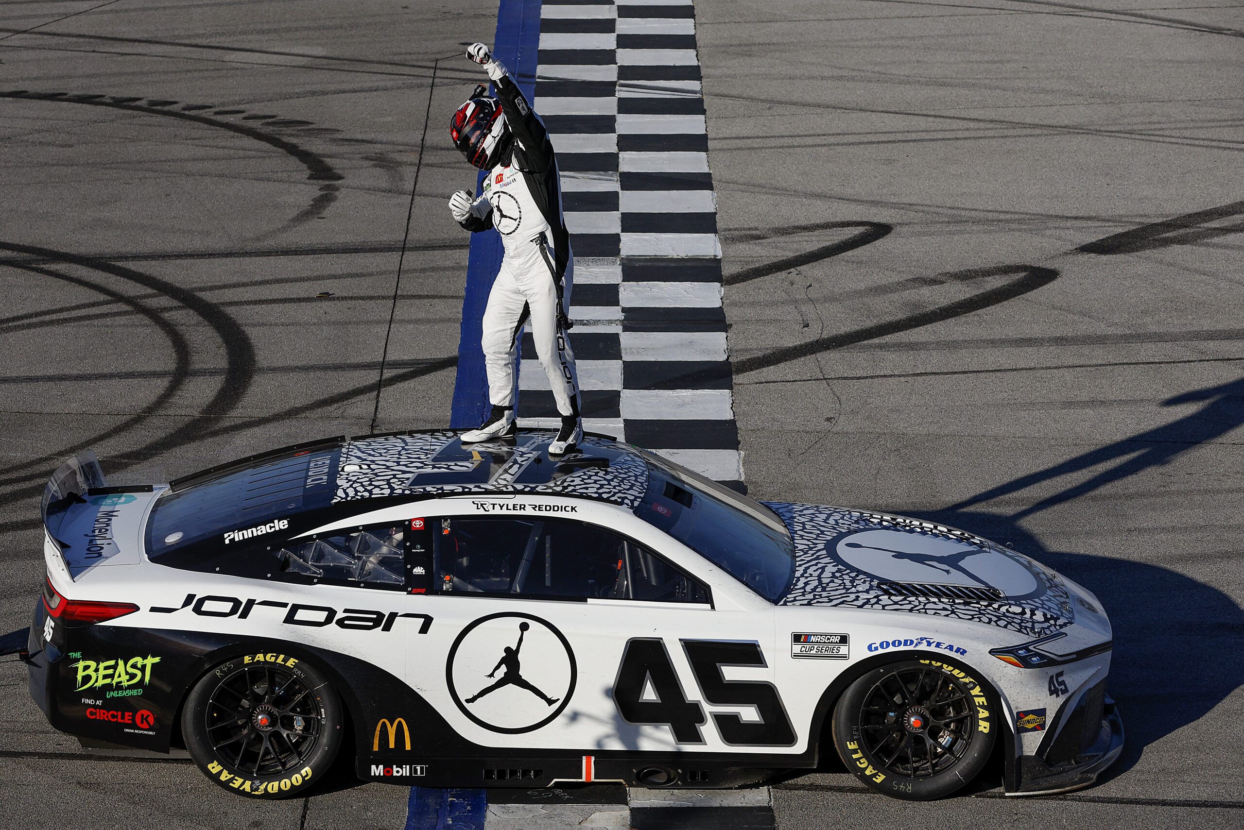 Reddick dodges final lap carnage for wild Cup victory at Talladega