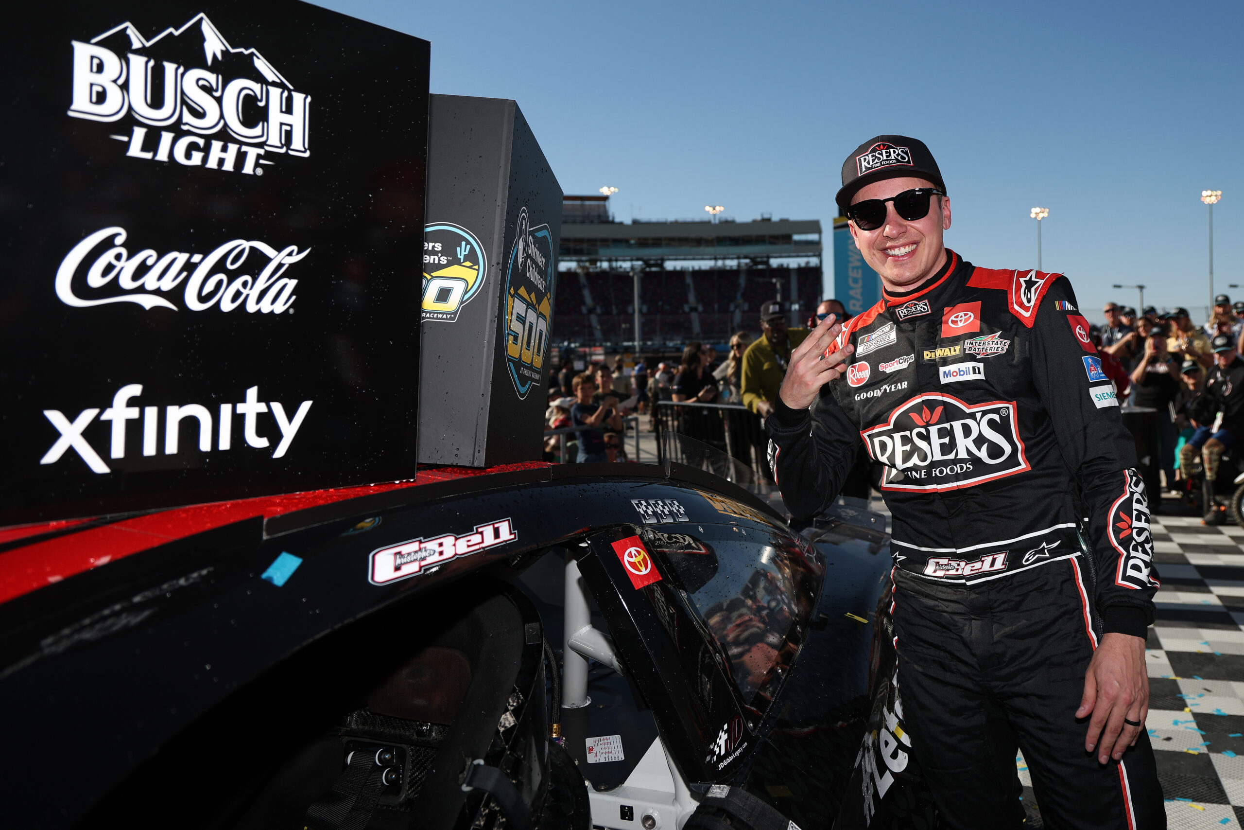 Christopher Bell edges Denny Hamlin for third consecutive Cup victory of 2025 at Phoenix