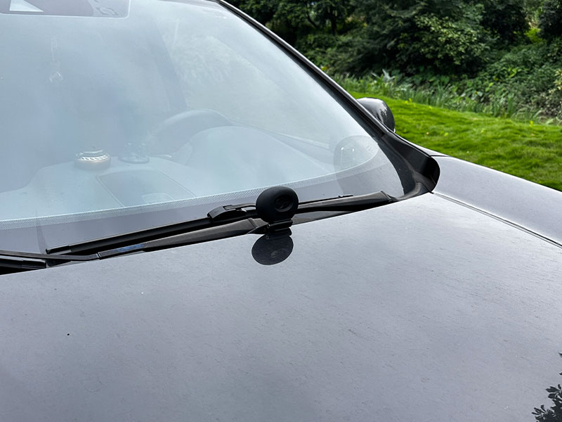 Securely mounts the camera on the hood