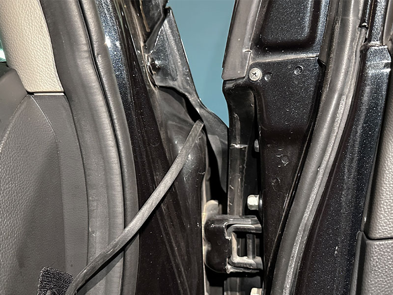 Pass the camera cable through the A-pillar inside the car
