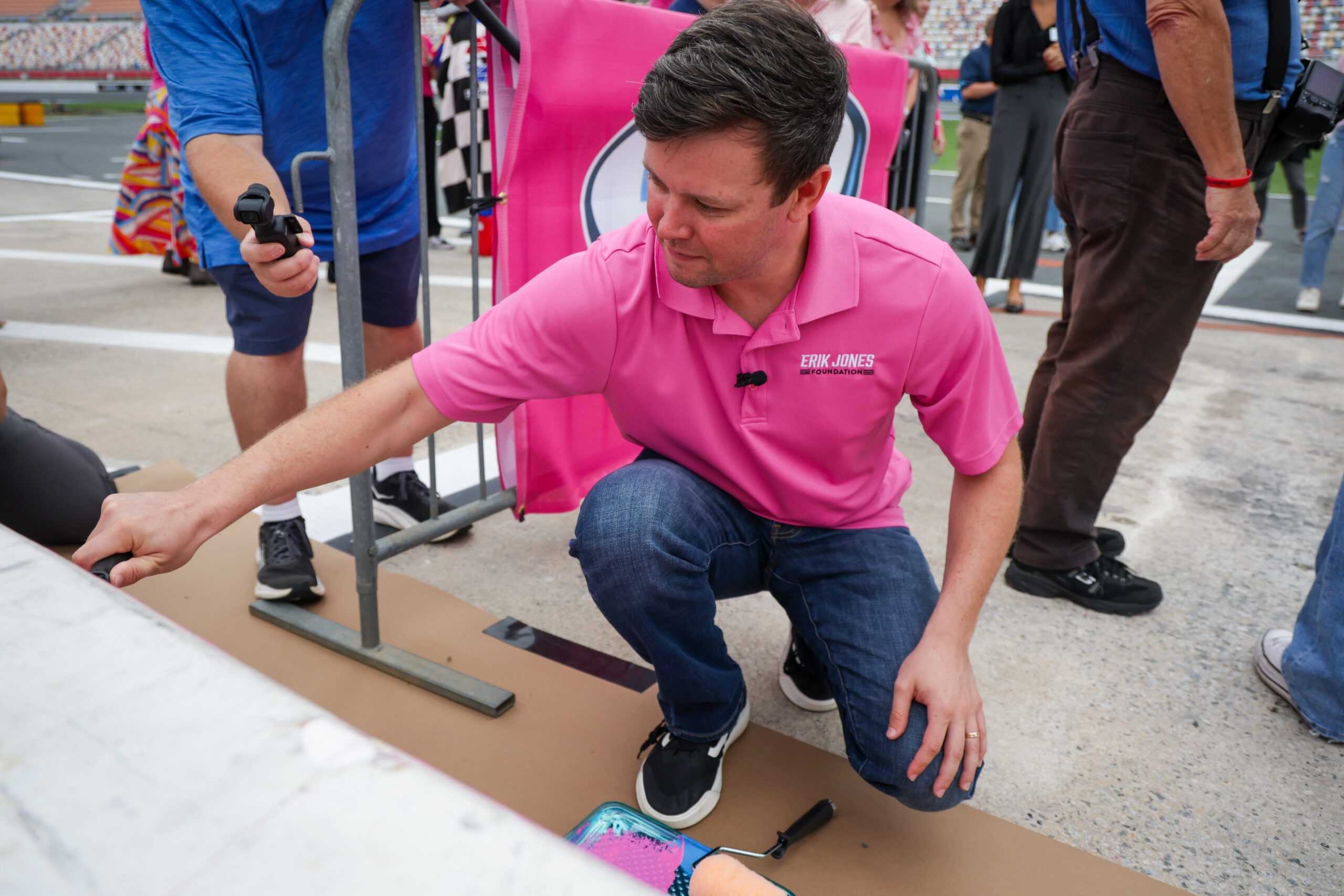 Erik Jones Joins Blue Cross NC, Breast Cancer Survivors To Paint Pit Wall Pink
