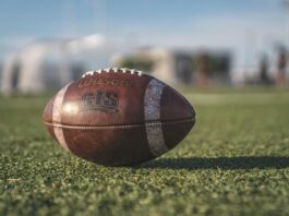 Football on green field