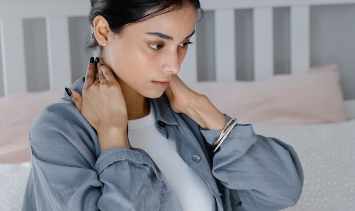 Woman massaging her neck