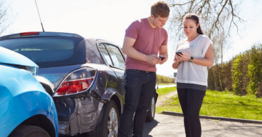 Drivers exchanging information after a San Antonio car accident.