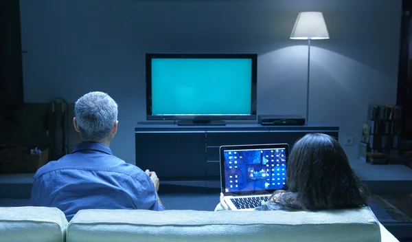 depositphotos_24186567-stock-photo-adults-watching-tv-and-pc