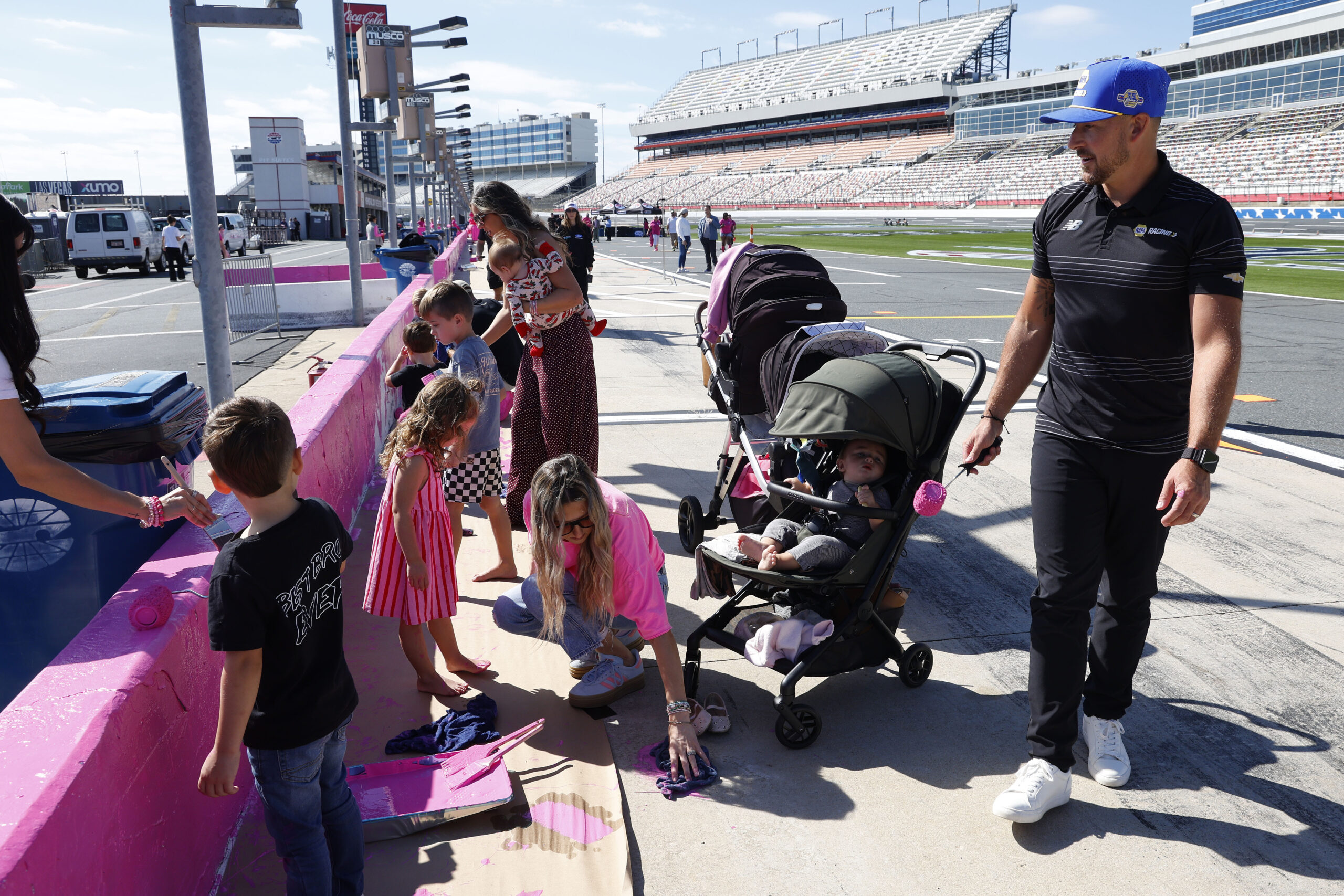 Breast Cancer Survivors, NASCAR Drivers Paint Pit Wall Pink Ahead of Blue Cross NC 300 Breast Cancer Survivors, NASCAR Drivers Paint Pit Wall Pink Ahead of Blue Cross NC 300